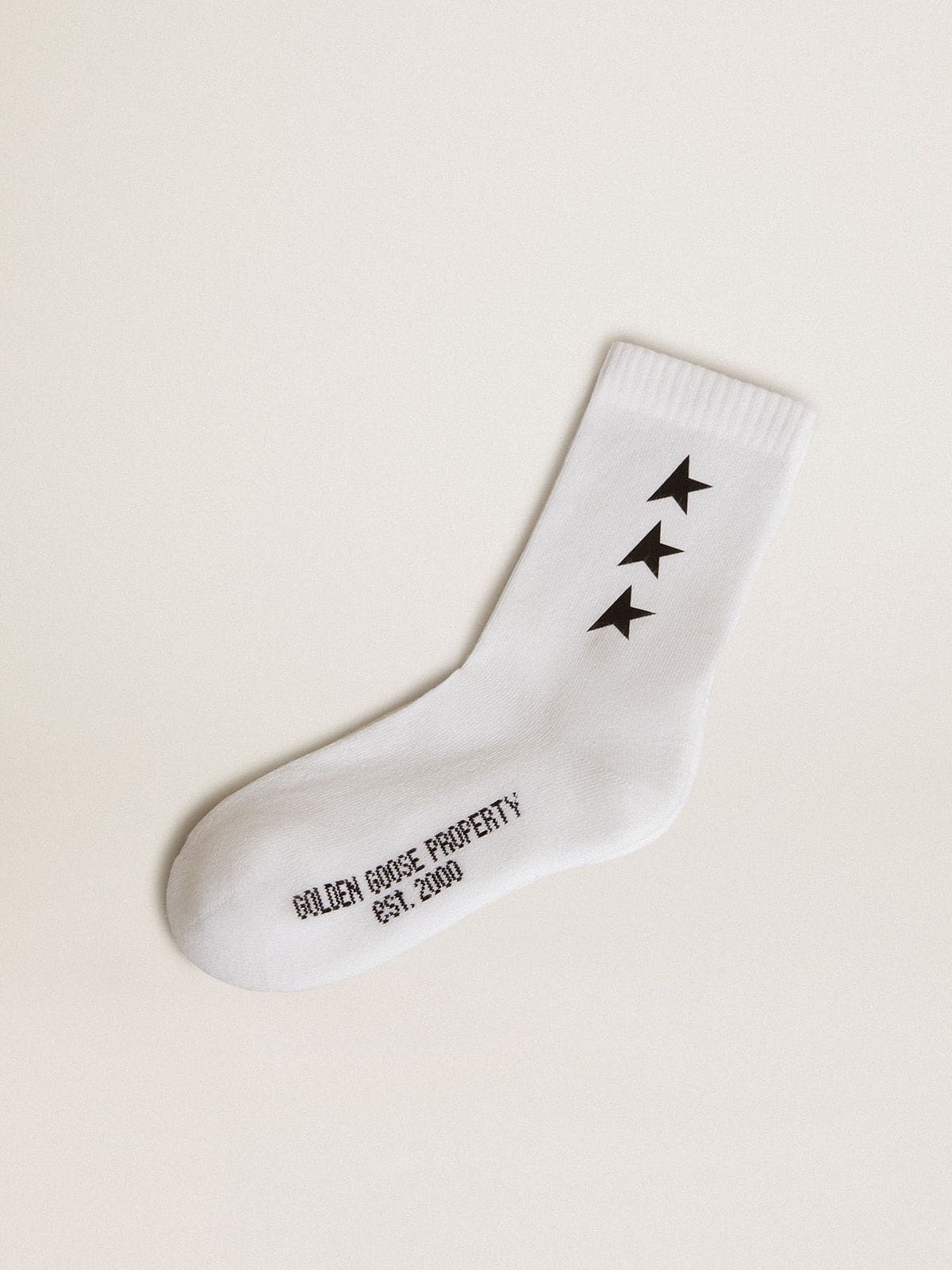 Wei&szlig;e Socken mit schwarzen Kontraststernen