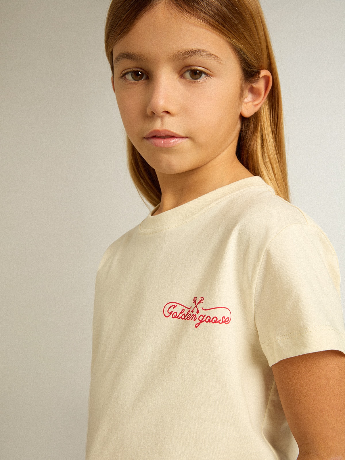 Golden Goose - Girls' cotton T-shirt in worn white with red embroidery on the chest in 