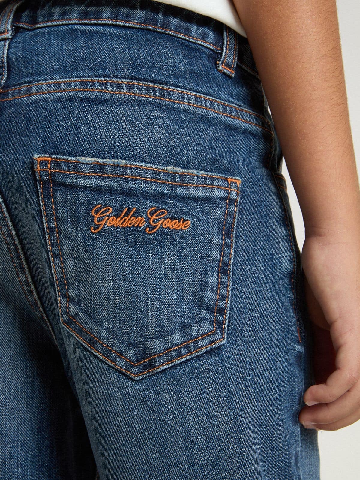 Golden Goose - Pantalón vaquero de niño en denim con corte sin rematar y bordado in 
