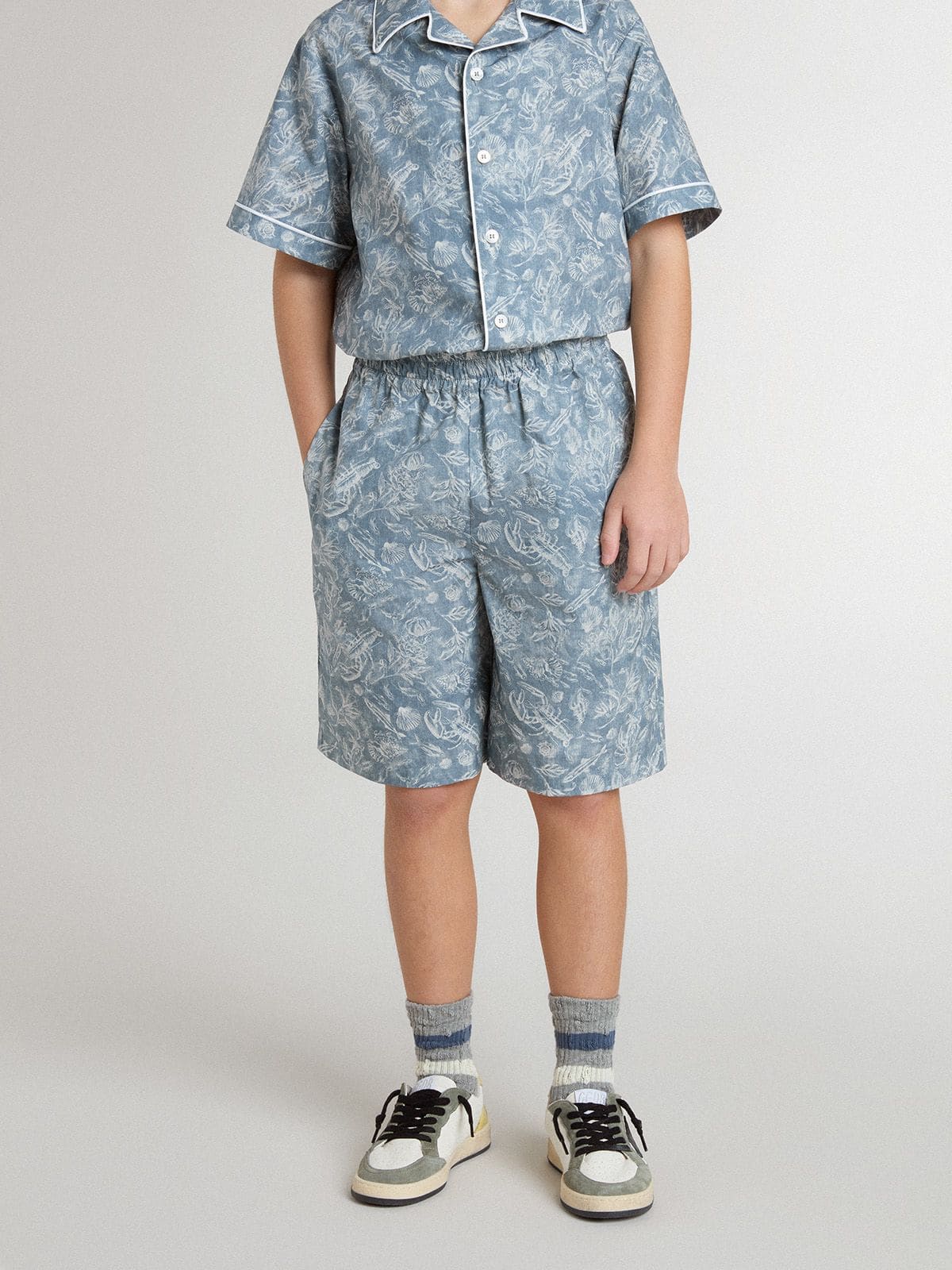 Boys’ blue shorts with white print 