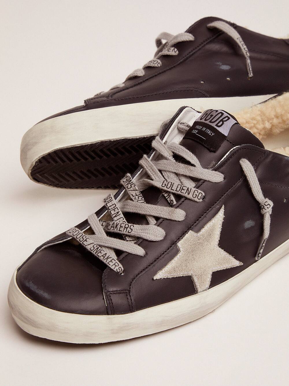 Super-Star sneakers in black leather with shearling padding | Golden Goose