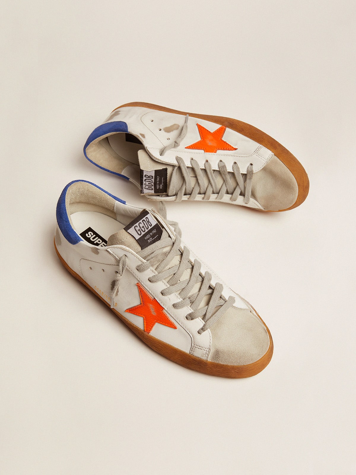 Golden Goose - Super-Star sneakers with blue suede heel tab and neon orange star in 