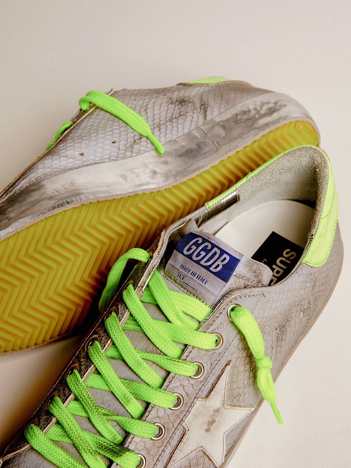 Golden Goose - Super-Star sneakers in silver snake-print leather with fluorescent leather heel tab in 