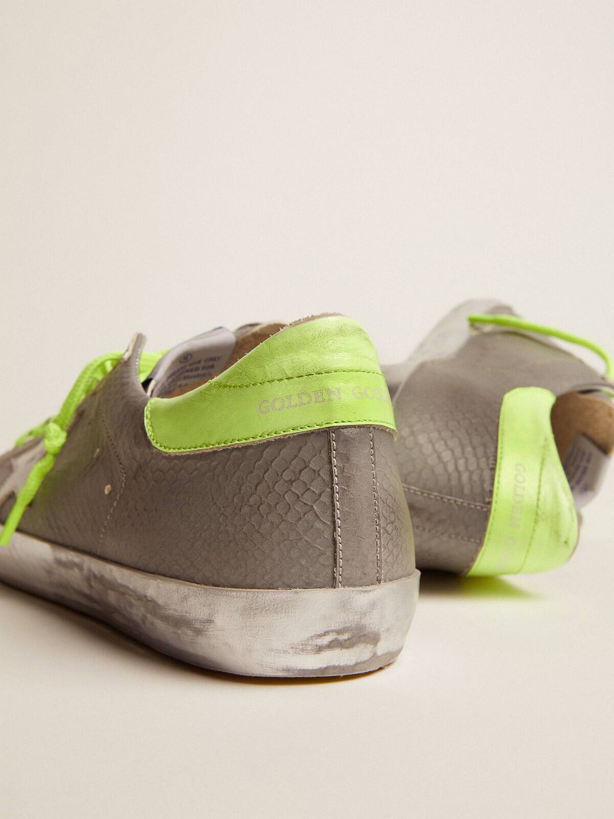 Golden Goose - Super-Star sneakers in silver snake-print leather with fluorescent leather heel tab in 
