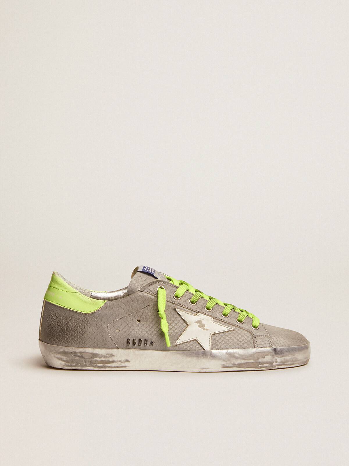 Golden Goose - Super-Star sneakers in silver snake-print leather with fluorescent leather heel tab in 