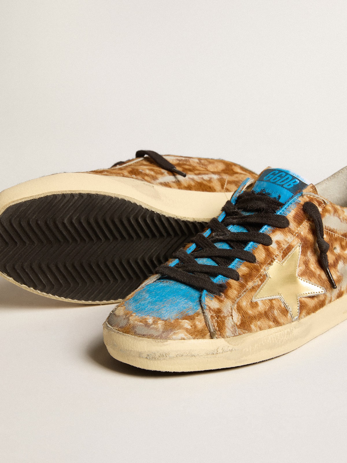 Golden goose uomo oro online