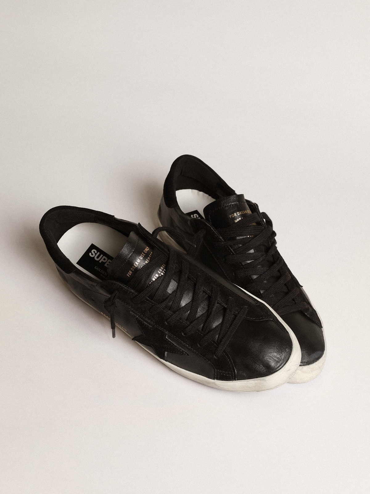 Men's Super-Star in black nappa with black suede star and heel tab