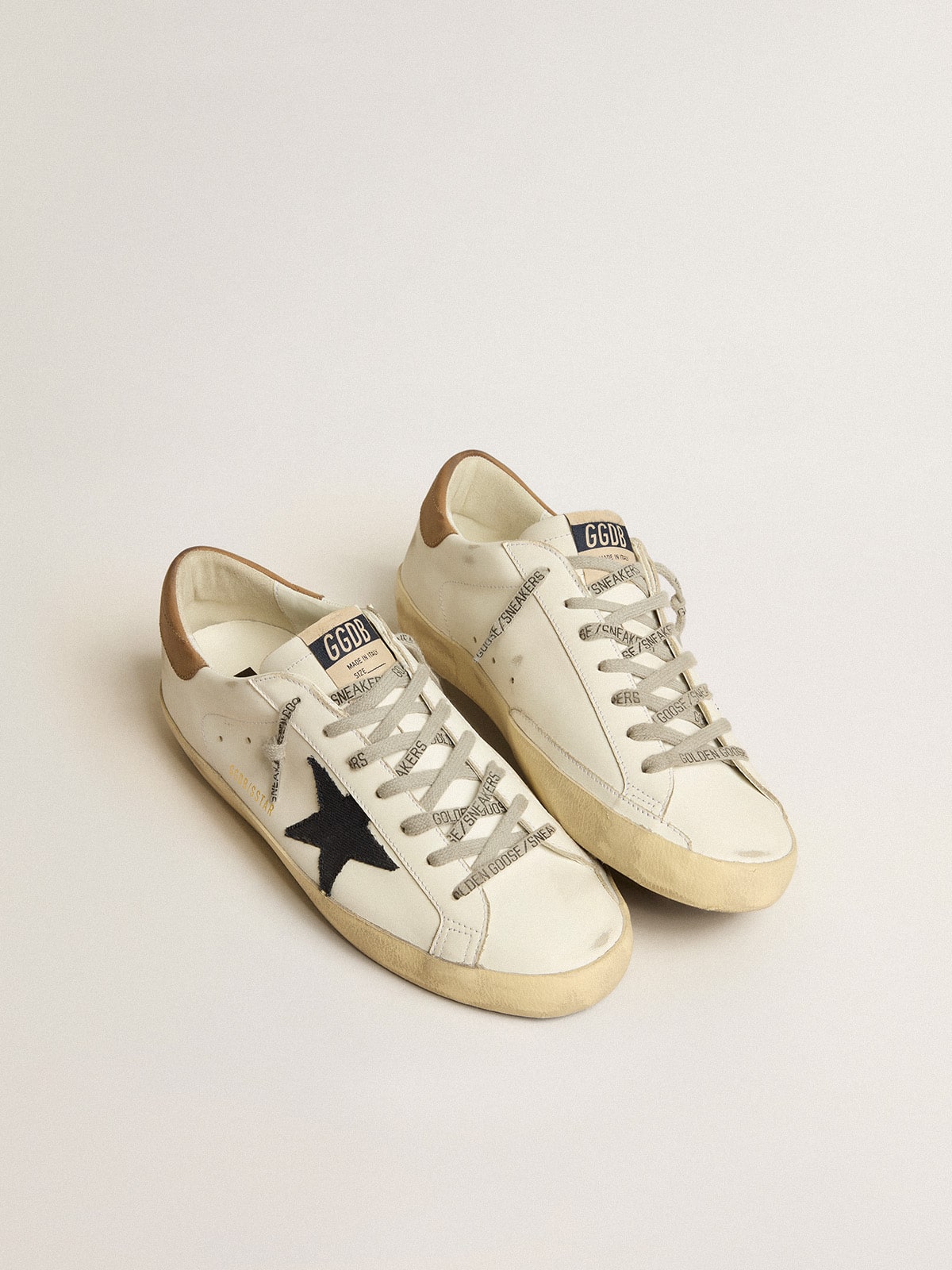 Men s Super Star with blue canvas star and tobacco leather heel tab Golden Goose