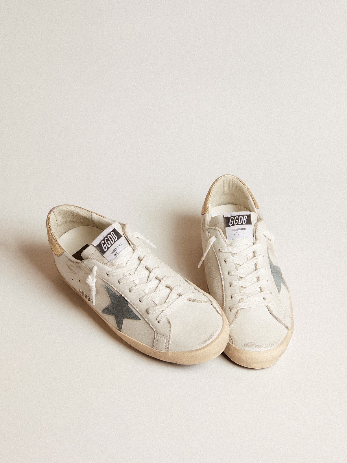 Super-Star with suede star and platinum snake-print leather heel tab