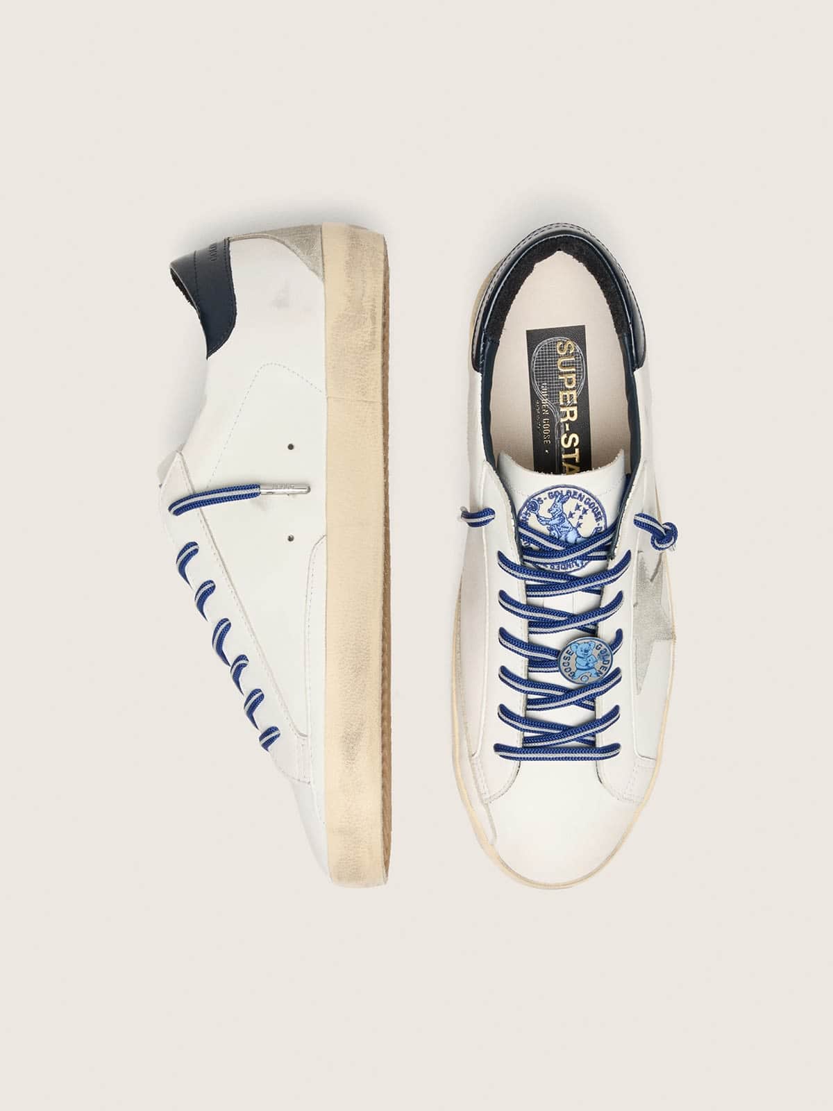 Men's tennis-inspired Super-Star LTD in white leather with suede star and blue leather heel tab