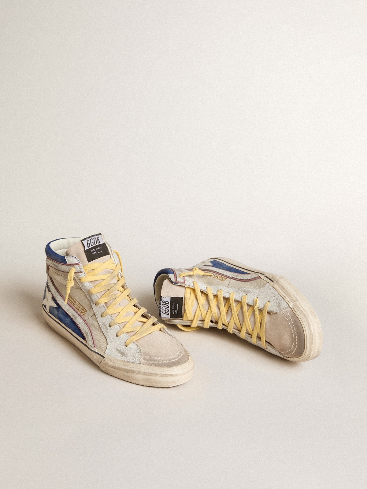 Golden Goose - Slide de lona cor pérola e suede azul com estrela e lista de couro branco in 