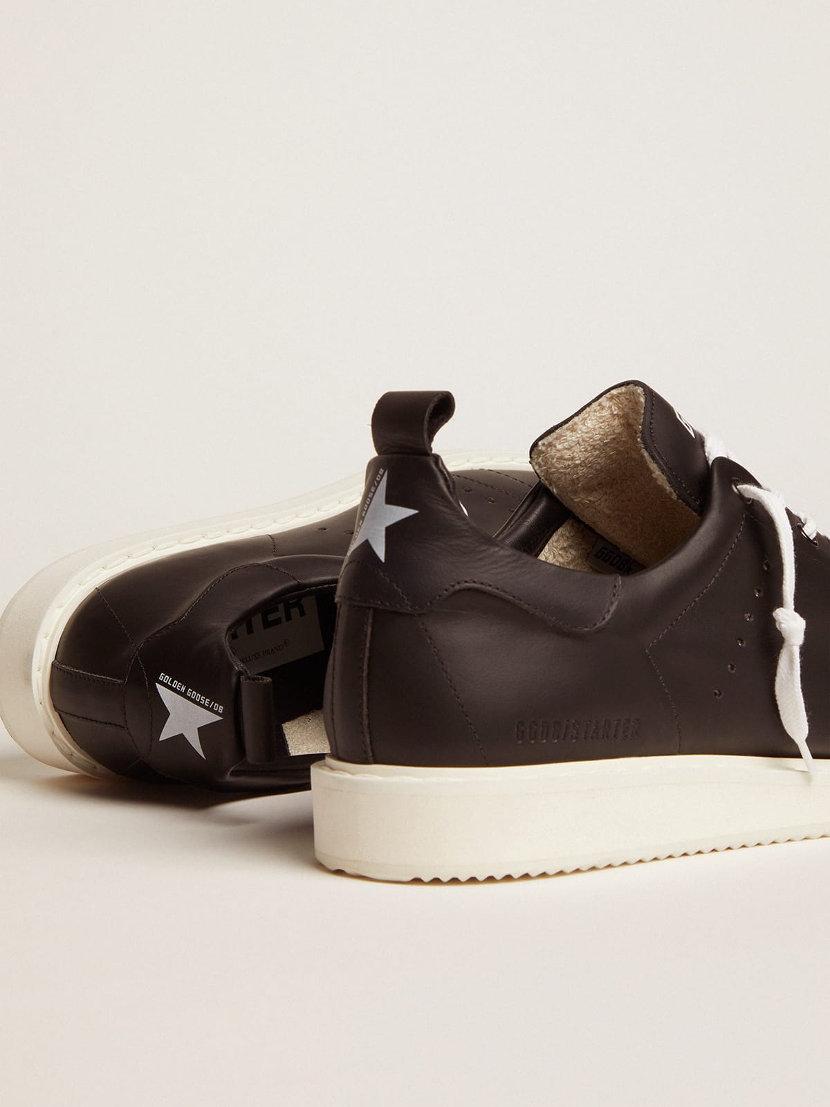 Men s Starter in leather with star printed on the heel tab Golden Goose