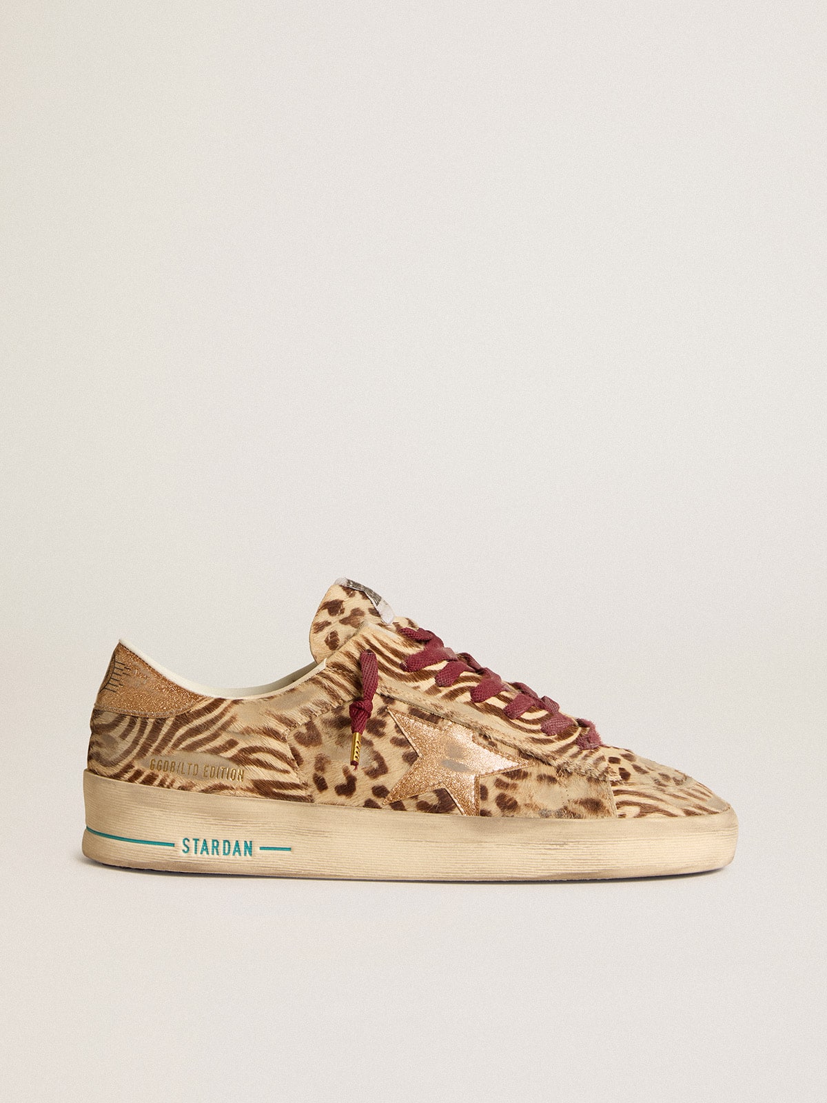 Men s Stardan LTD in animal print pony skin with gold glitter star Golden Goose