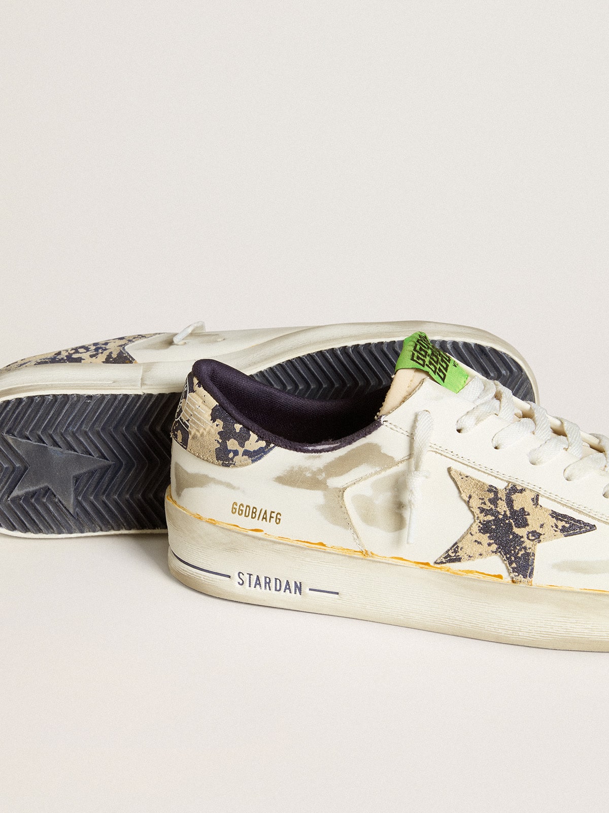 Men s Stardan LAB in white leather with a camouflage star and heel tab Golden Goose