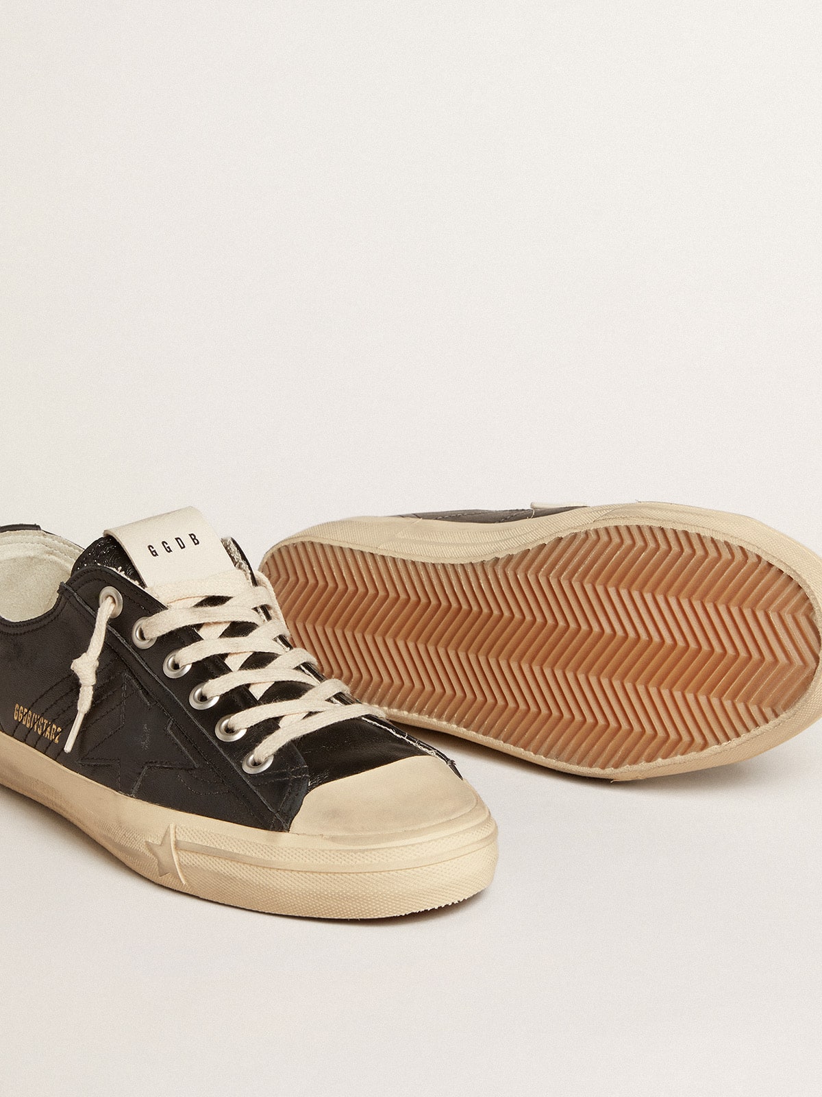 Men s V Star in black nappa leather with a black leather star Golden Goose