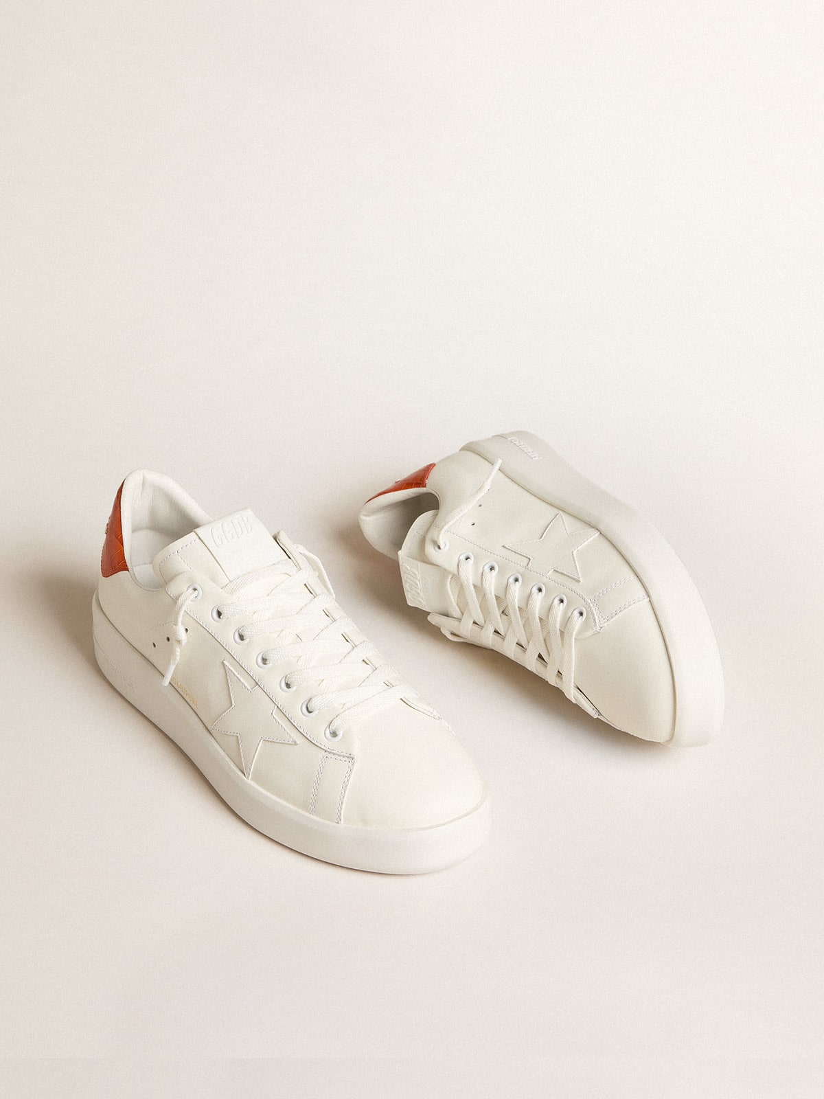 Men s Purestar with white leather star and orange heel tab Golden Goose