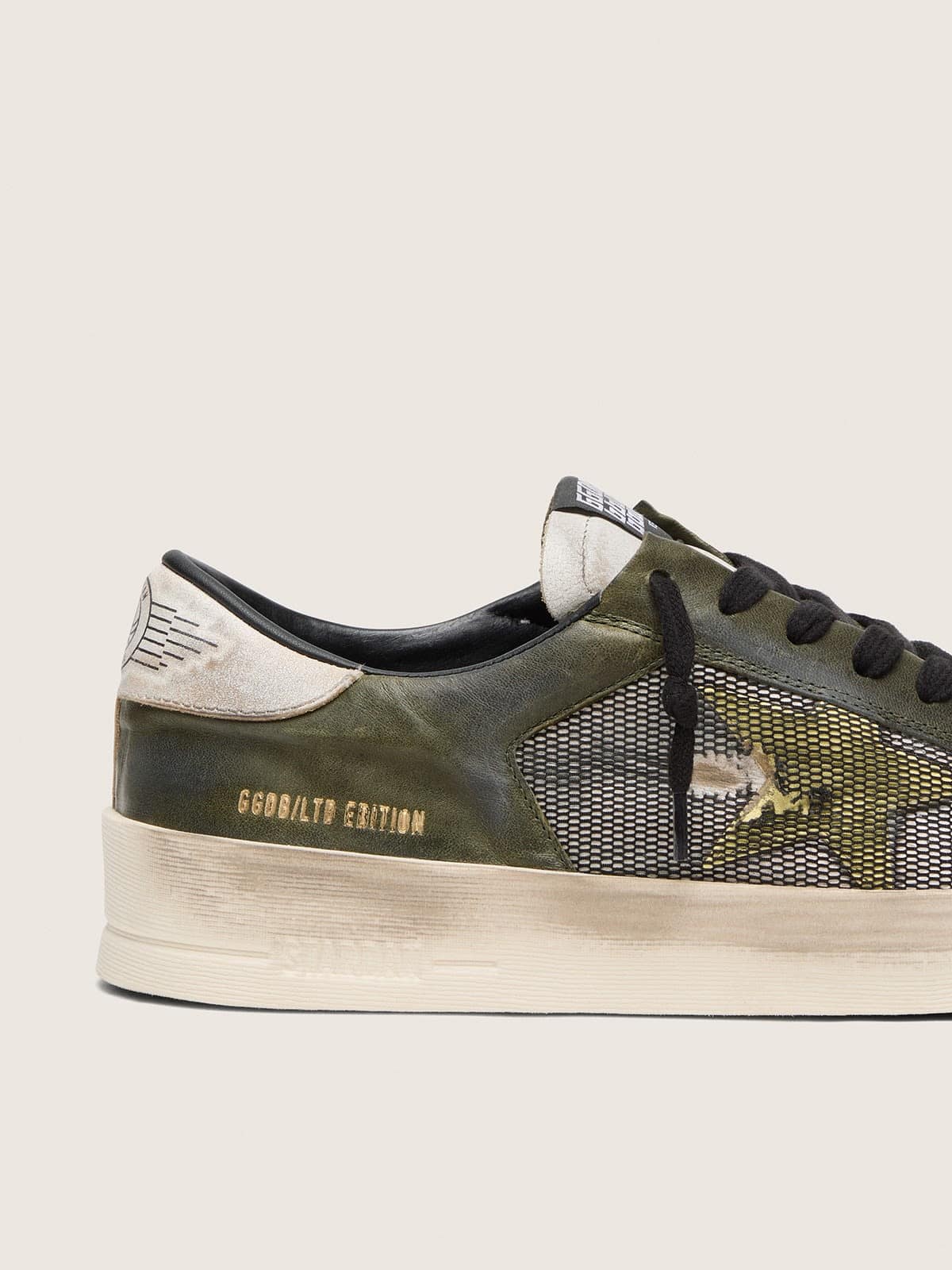Golden Goose - Stardan LTD uomo in pelle bianca e verde oliva con rete nera e stella in pelle gialla in 