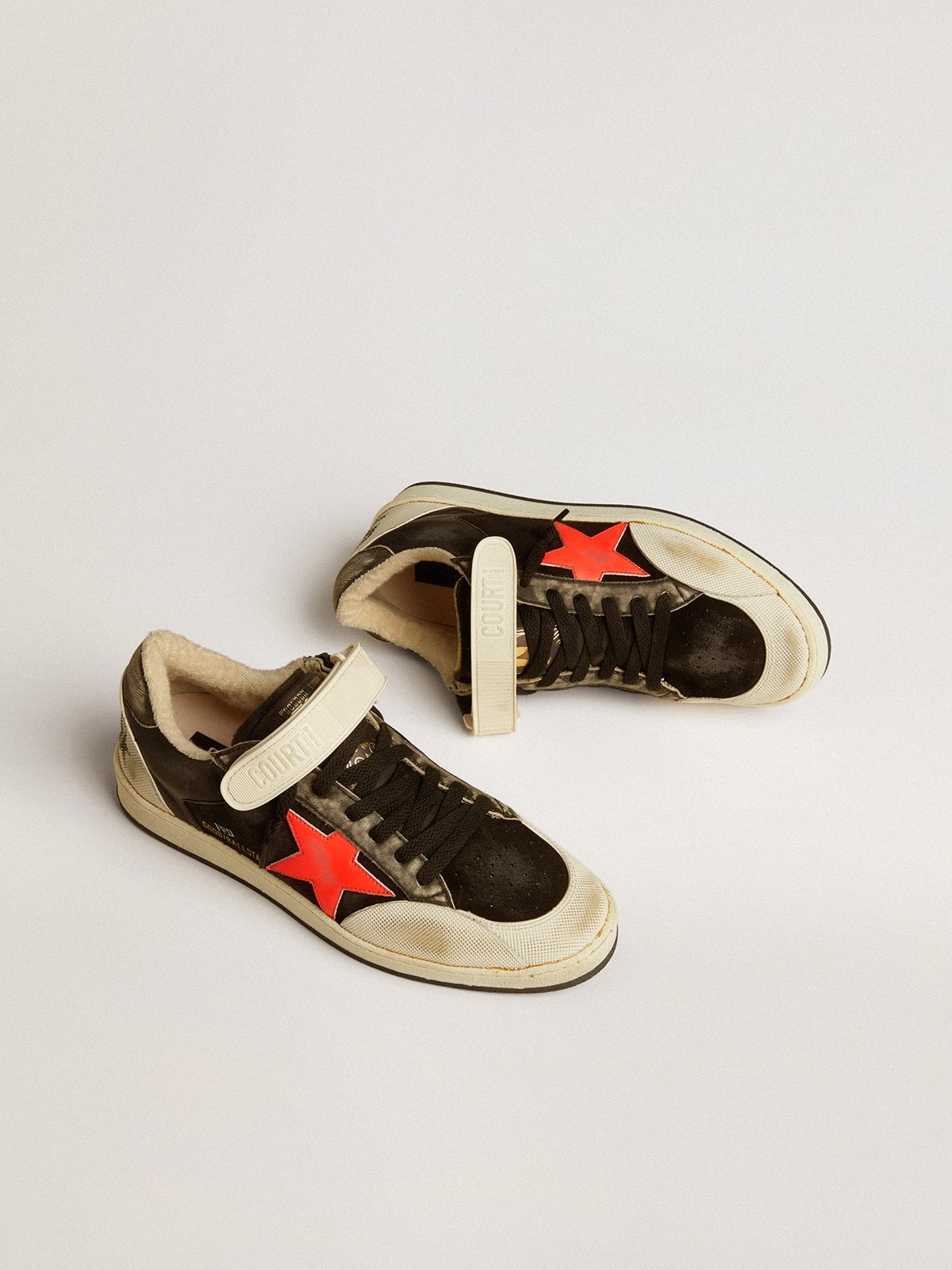 Ball Star Pro in black suede with neon orange star Golden Goose