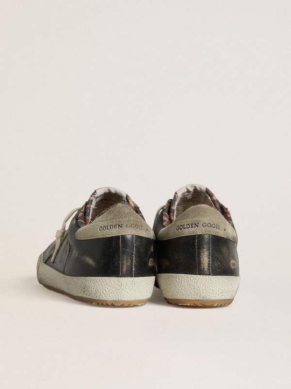 Golden Goose - Men's Super-Star in black leather with gray suede star and heel tab in 