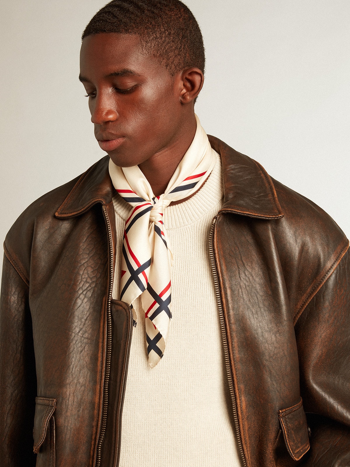 Men's white cotton cardigan with a cable pattern and blue