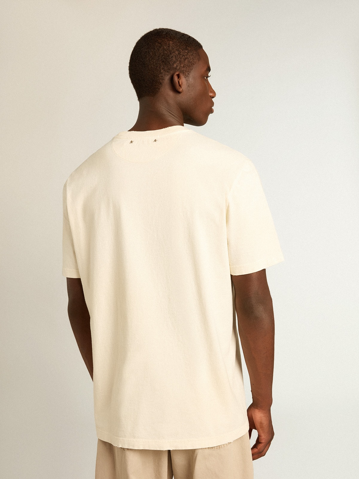 Men's aged white cotton T-shirt with print on the front