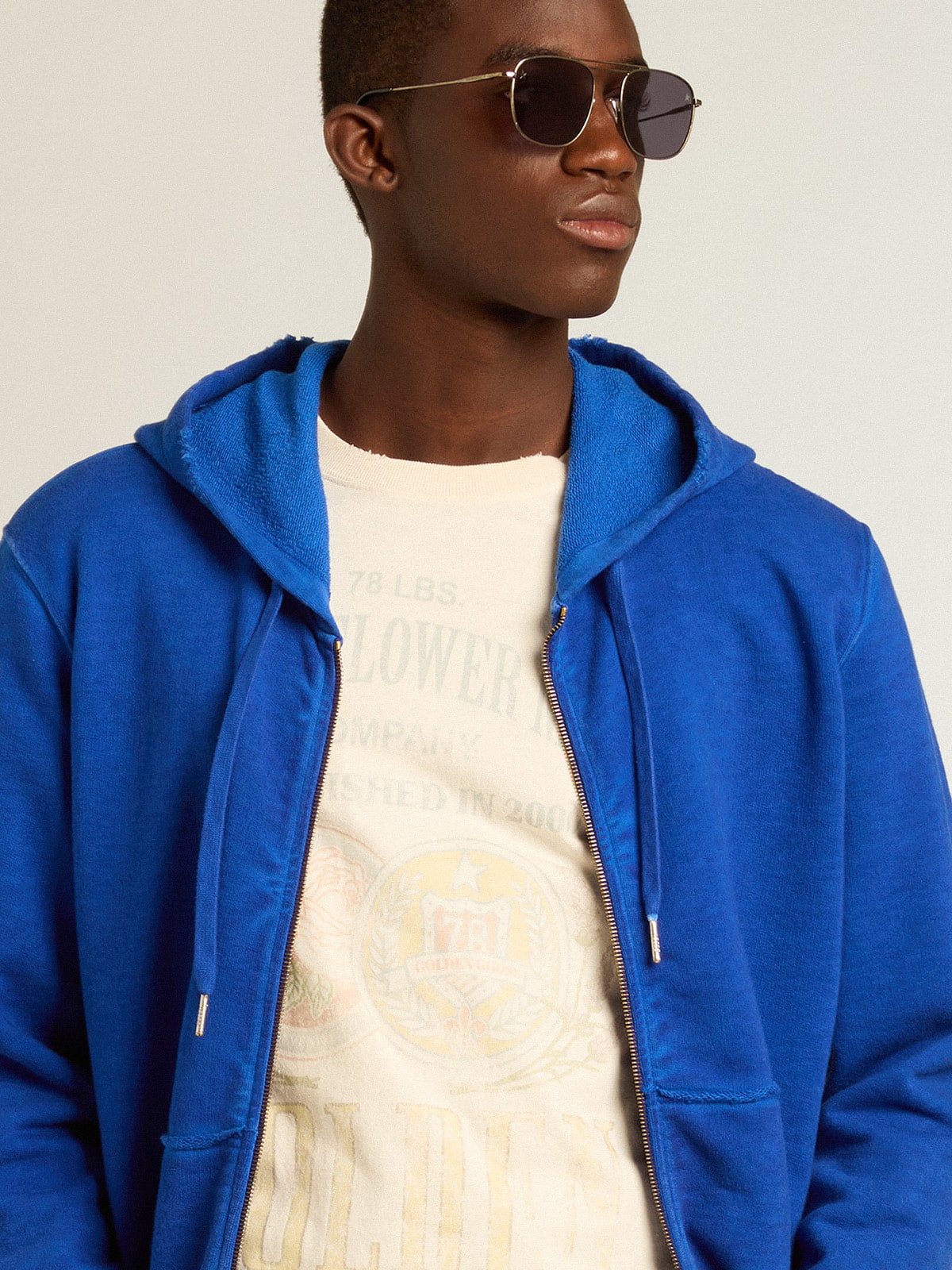 Men s blue colored hoodie with lettering on the back Golden Goose