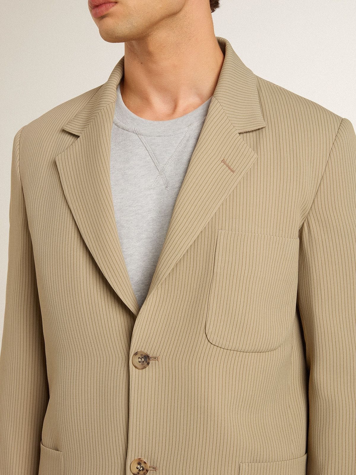 Men's beige pinstripe single-breasted jacket with an