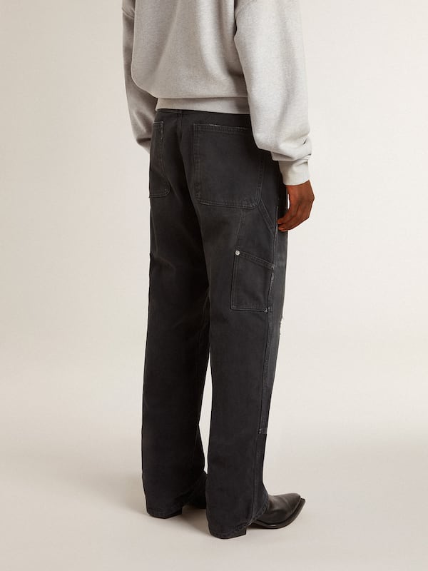 Golden Goose - Men's distressed black cotton jeans with front patches in 