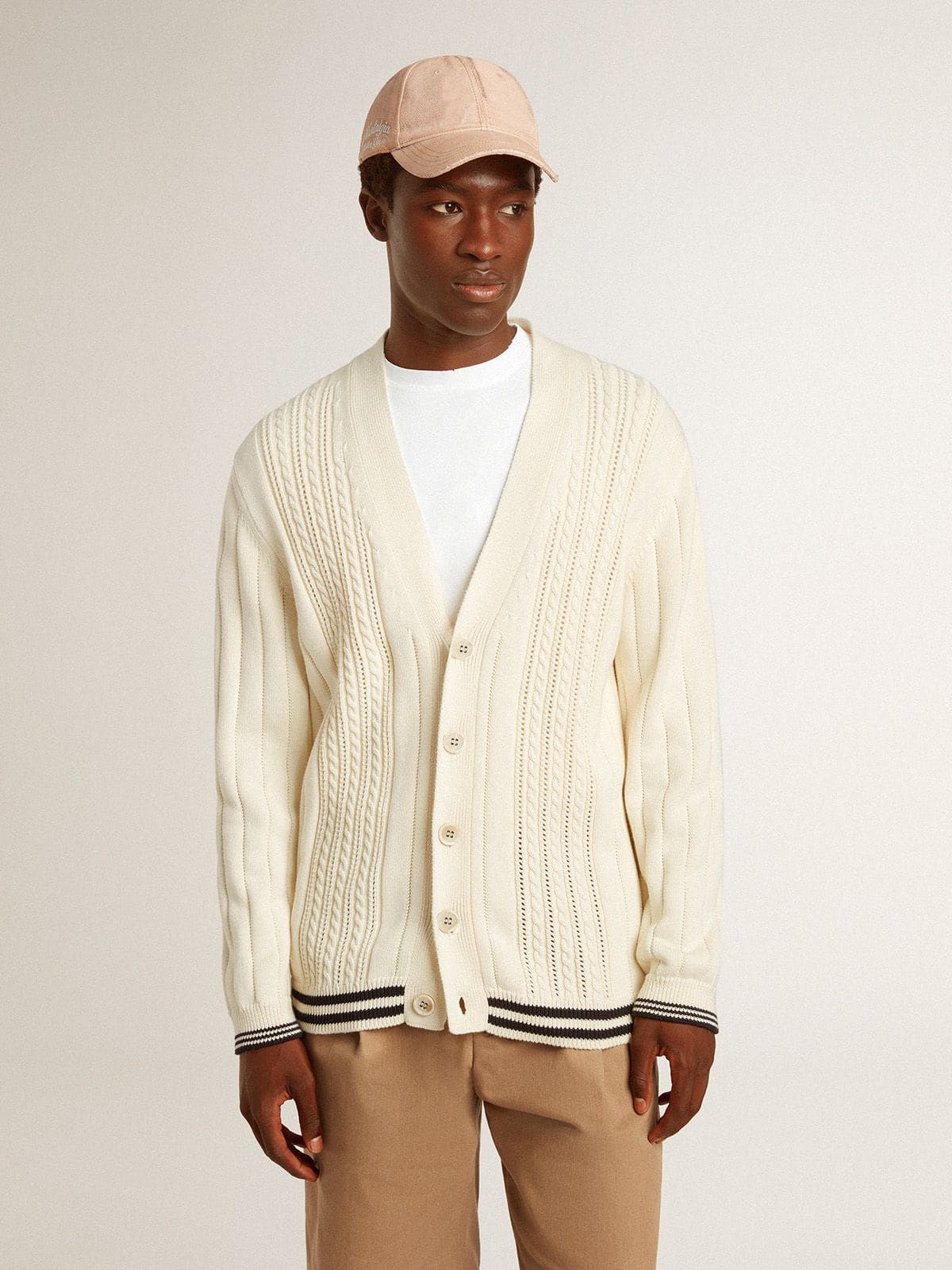 Men's white cotton cardigan with a cable pattern and blue ribbing