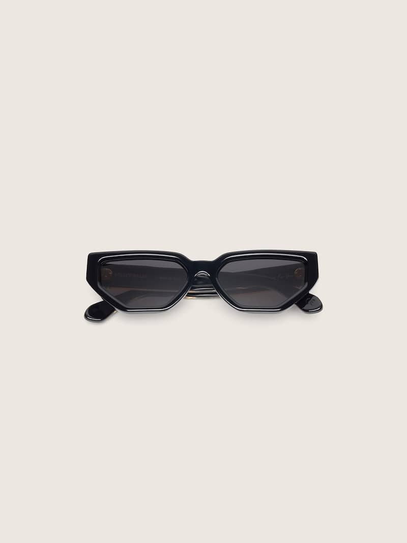 Gafas de sol modelo rectangular Jackie con montura negra y lentes transparentes