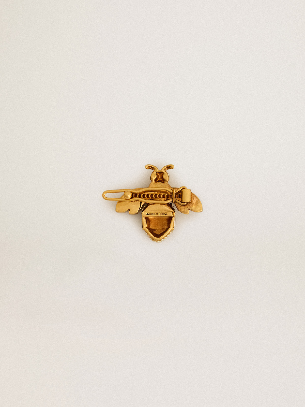 Golden Goose - Bee-shaped lace tag in antique gold color with crystals in