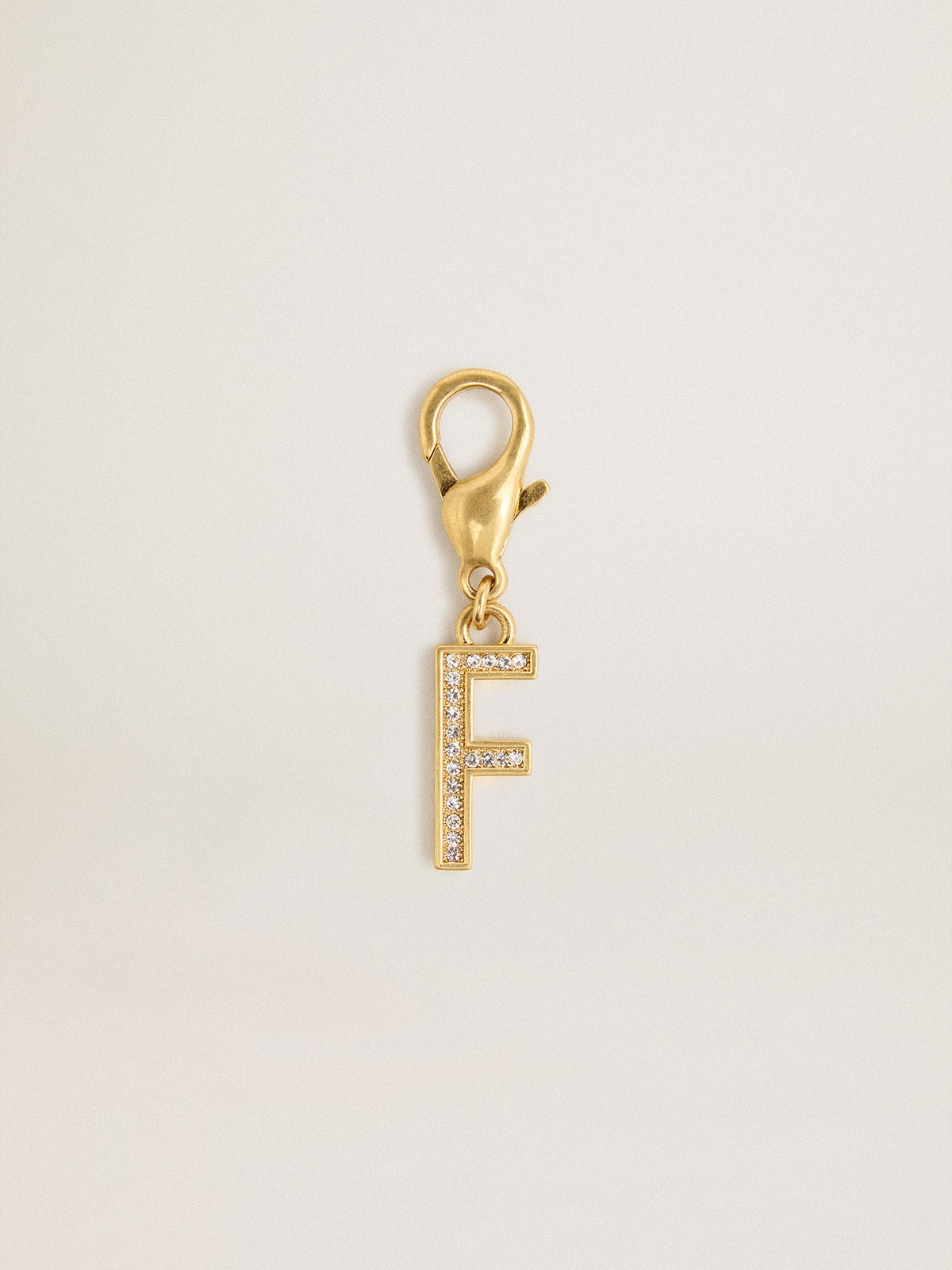 Golden Goose - Charm aus goldfarbenem Messing in Form des Buchstabens F mit Glassteinchen in 