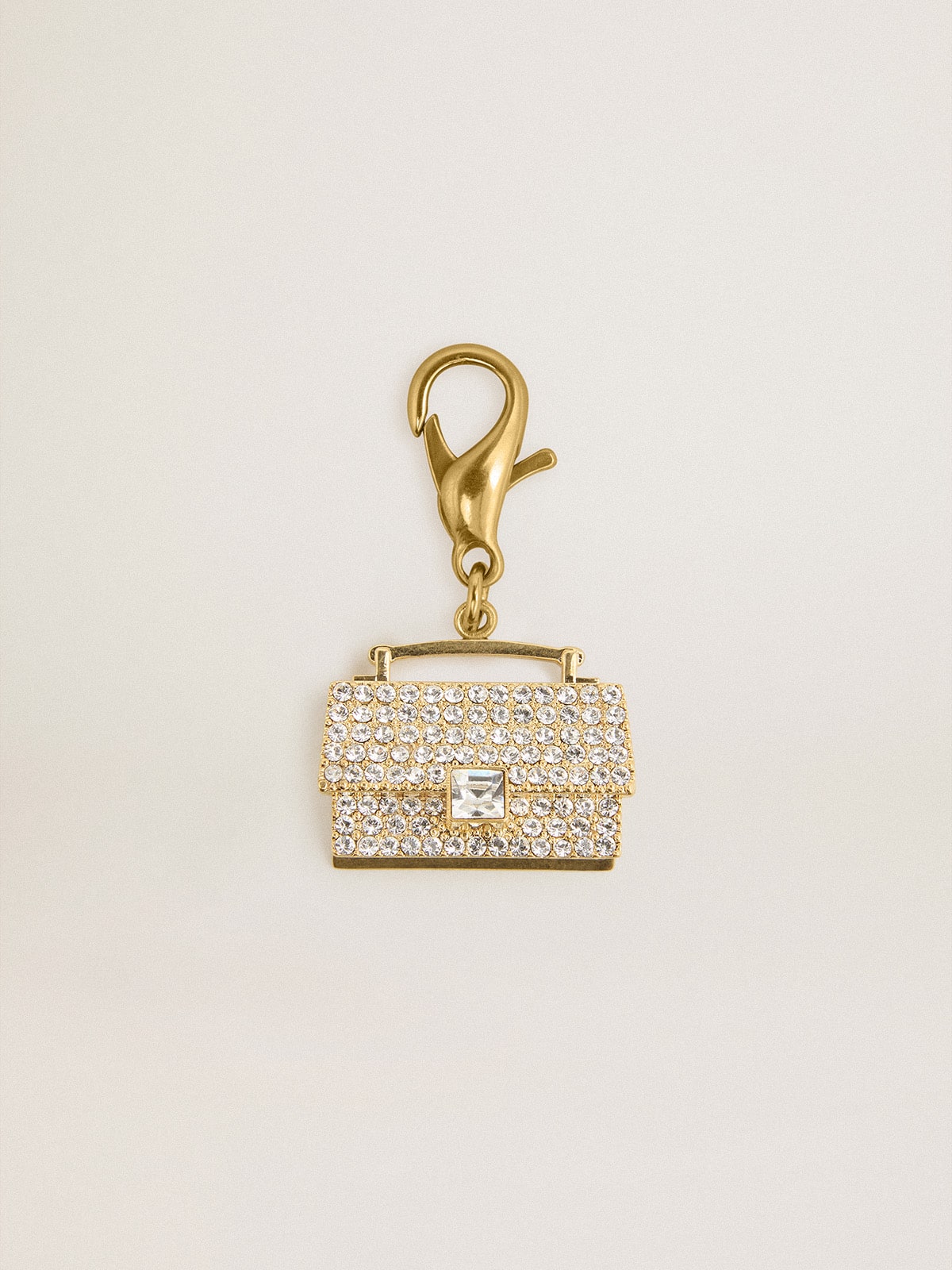 Golden Goose - Purse-shaped charm in gold-colored brass with crystals in 