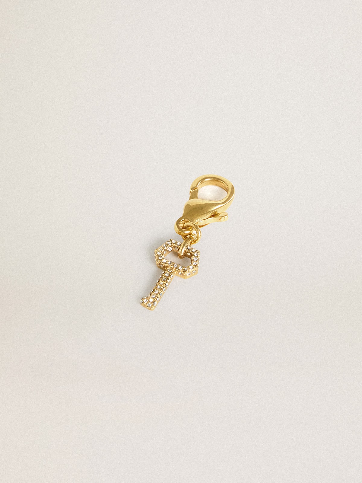 Golden Goose - Key-shaped charm in gold-colored brass with crystals in 