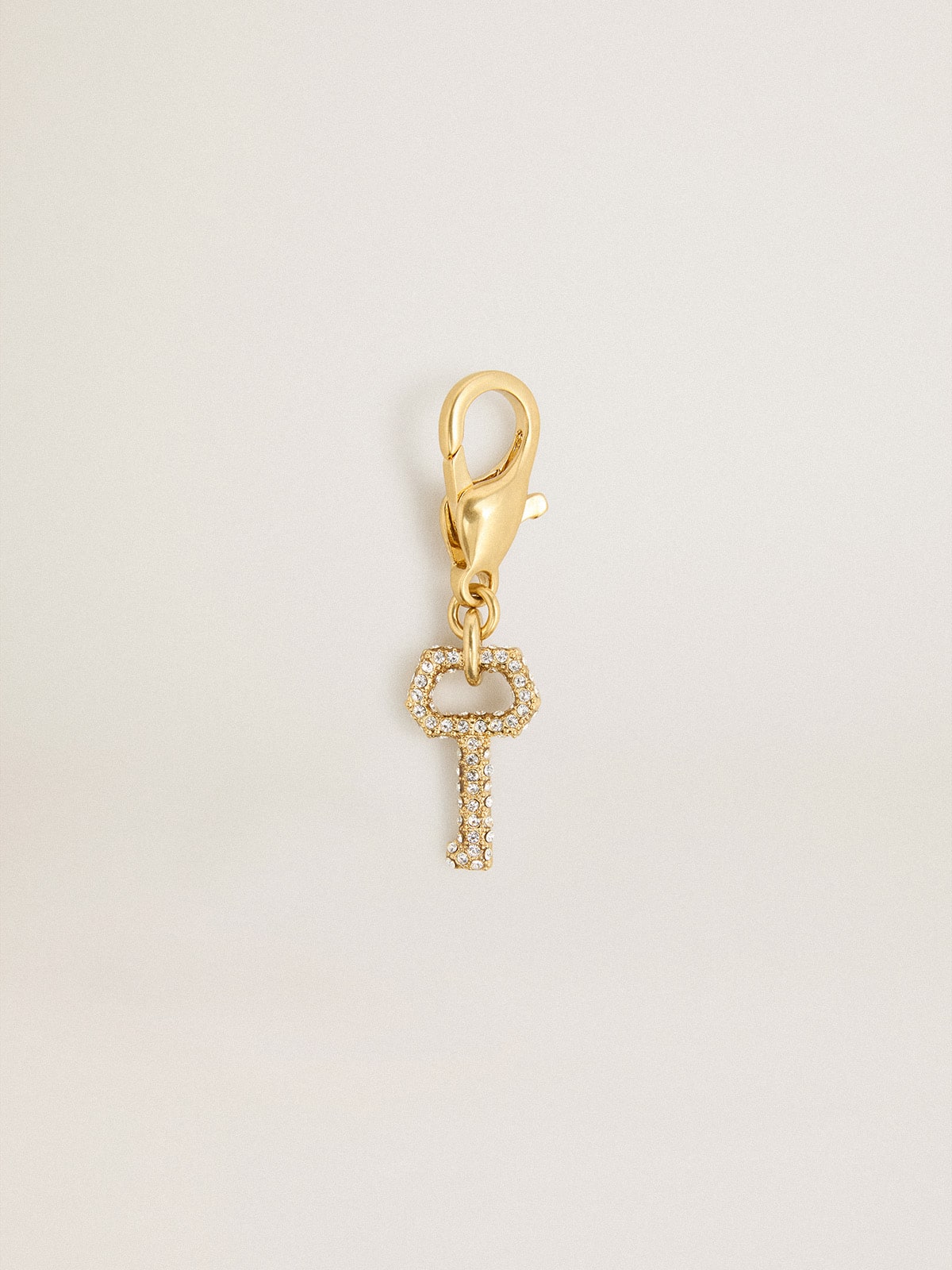 Golden Goose - Key-shaped charm in gold-colored brass with crystals in 