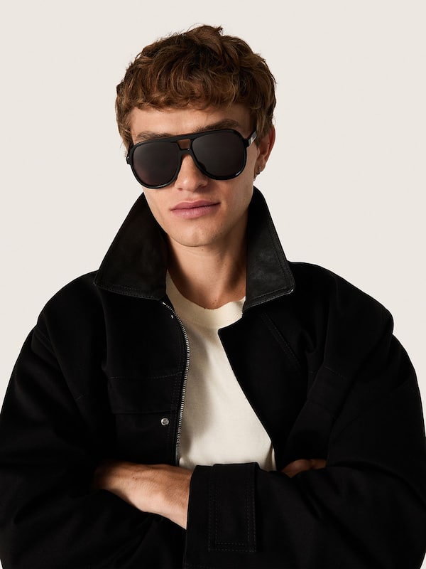 Aviator style sunglasses with black frame and lenses