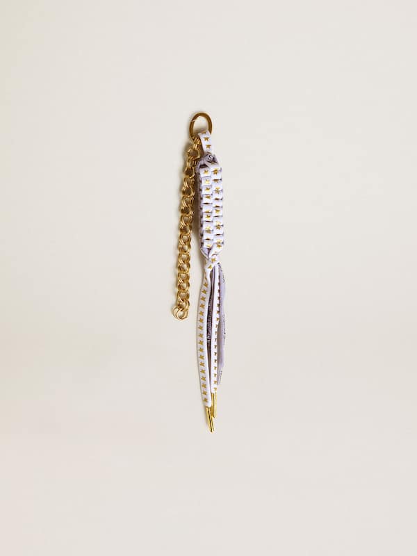 Charm with white knotted laces and gold stars 