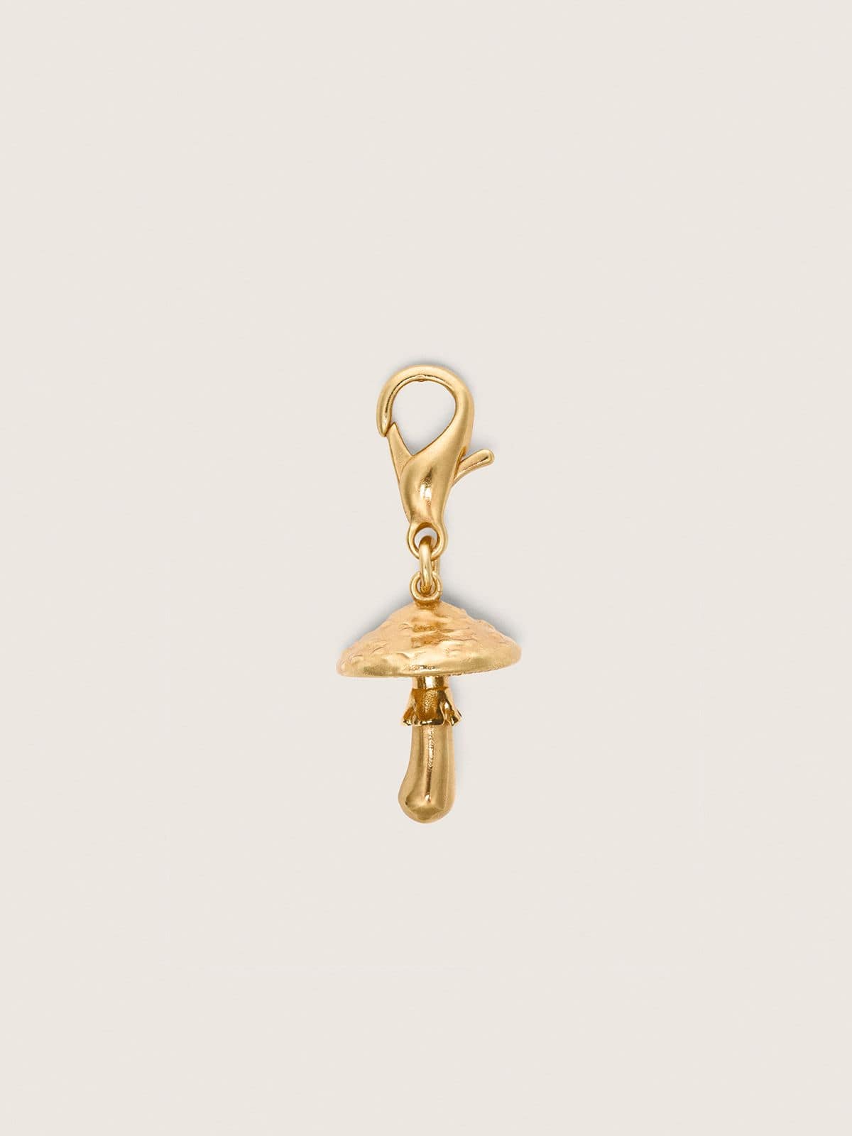 Mushroom charm in gold-colored brass
