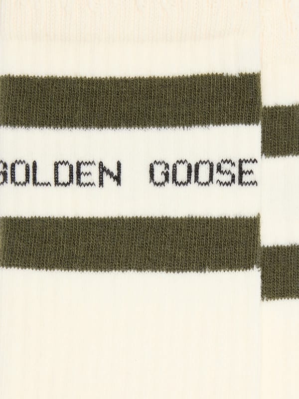 Cotton socks with distressed finishes, green stripes and black logo