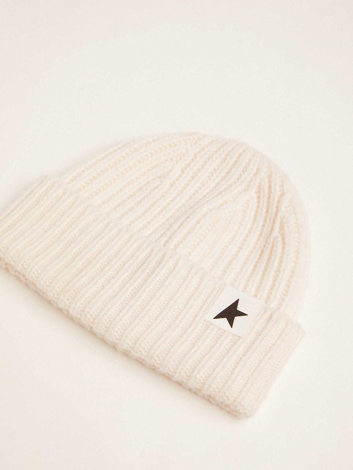 White wool beanie with black star