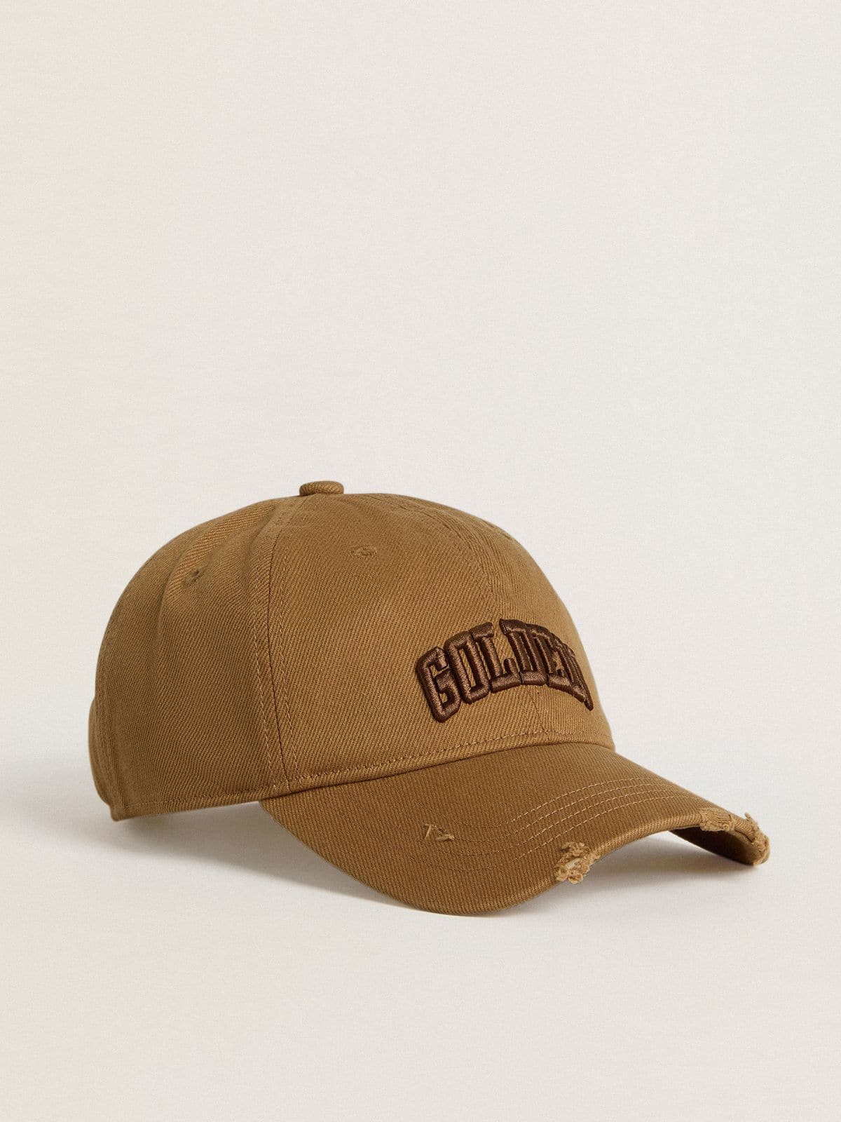 Cappellino da baseball in cotone color beige dal trattamento lived-in