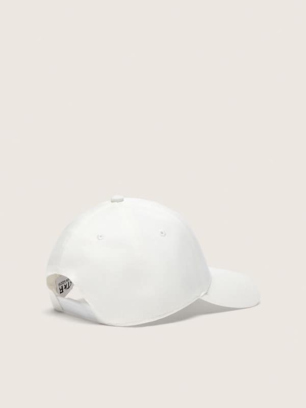White tennis-inspired cap with star, patches and pin