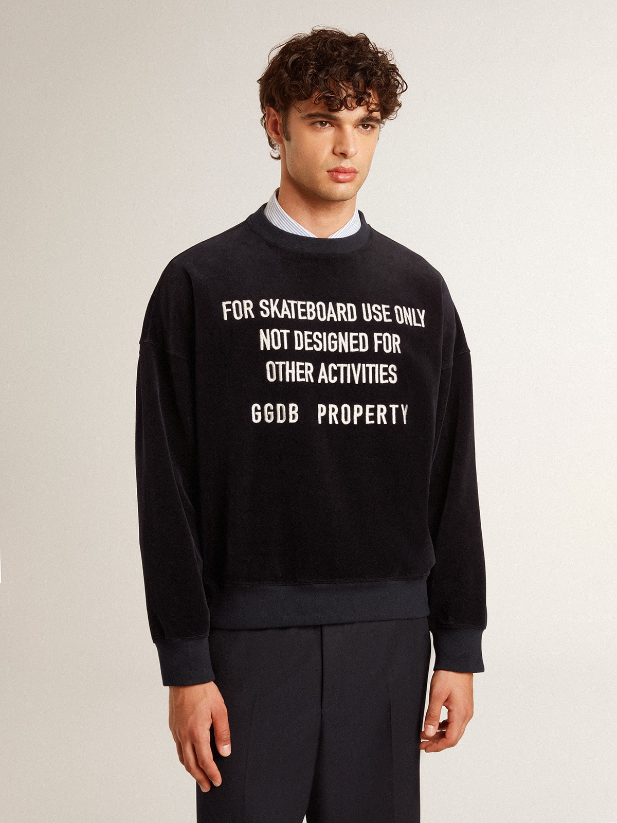 Black crew neck sweatshirt with embroidered lettering