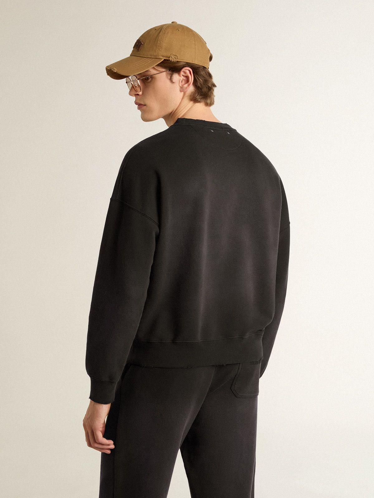Golden Goose - Unisex sweatshirt in worn black cotton with logo embroidery in 