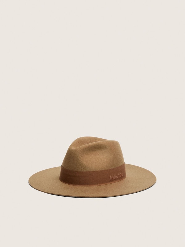 Beige fedora hat with ribbon strap and silver star