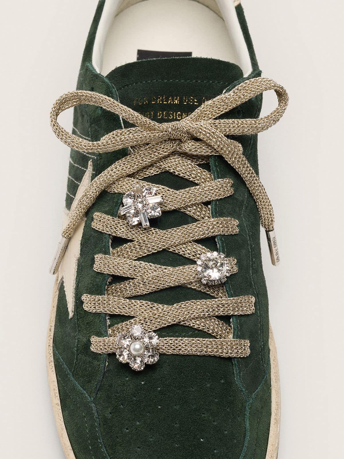 Lacets Skins « Sparkling » tressés couleur doré avec charms scintillants