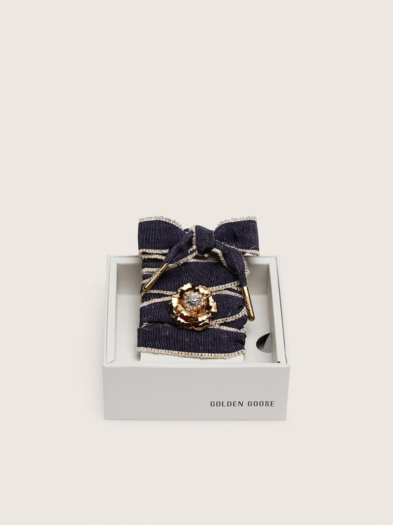 Skins "Sparkling" denim blue laces embellished with beige trim and a golden charm