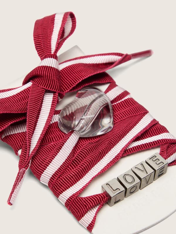 Skins red and white striped laces with charms