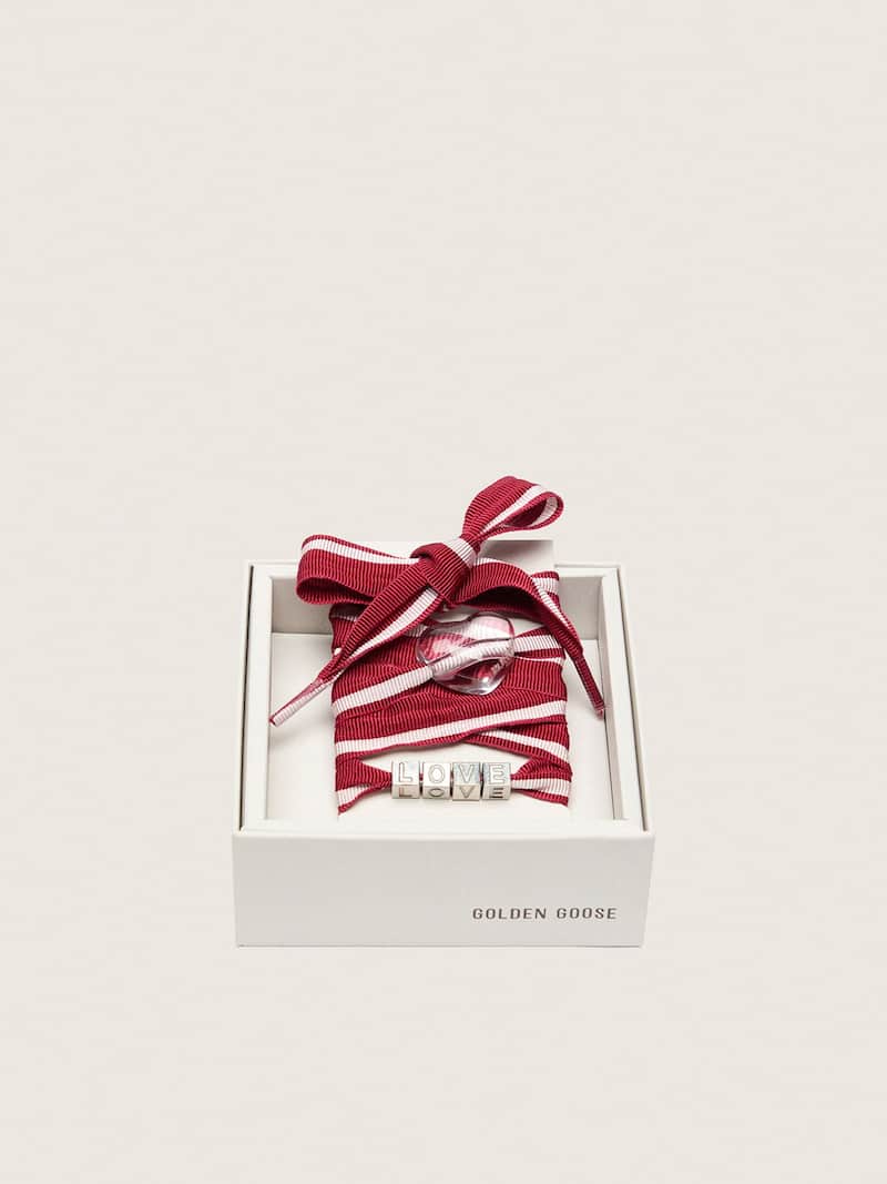 Skins red and white striped laces with charms