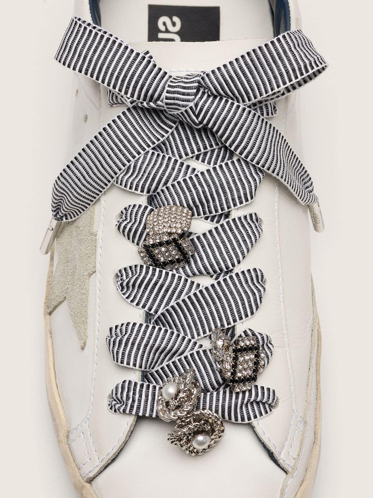 Skins striped laces embellished with charms